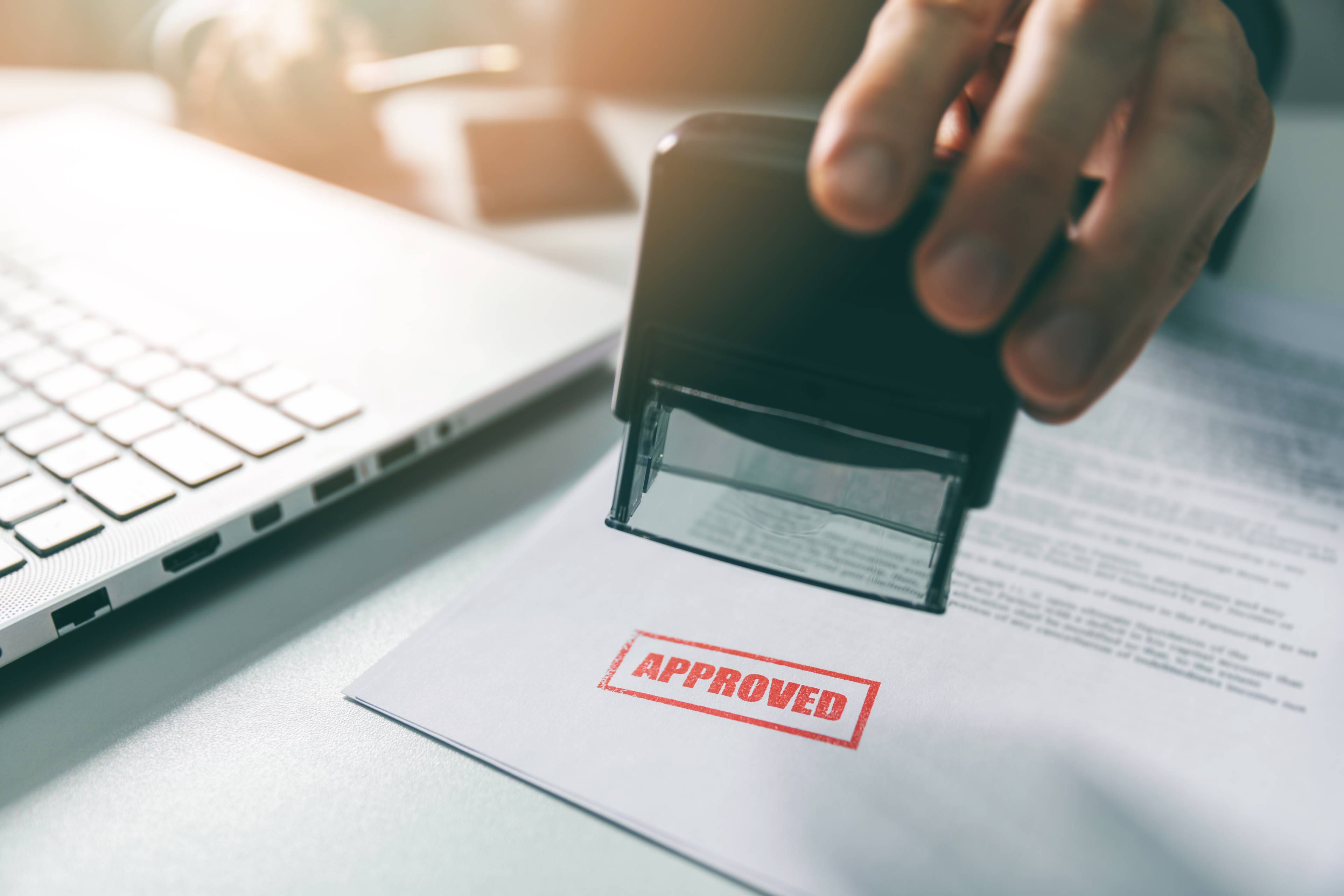 Image of a team member approving a document